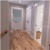 Hand Scraped Hickory Natural Hurst Hardwoods Prefinished Solid Flooring installed in a hallway